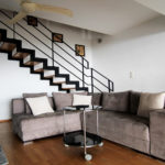 Spacious living room with ceiling fan on the 1st floor