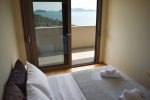 Sea view bedroom with panoramic windows, 2nd floor of the Feel the Sea Villa